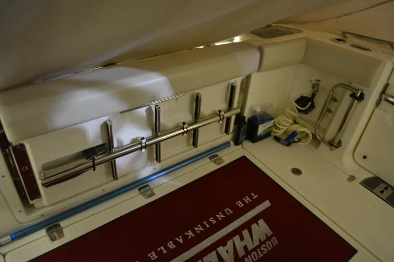 Slide: The Image of Interior view of a 2019 Boston Whaler 350 Realm boat with beige seating. - 21