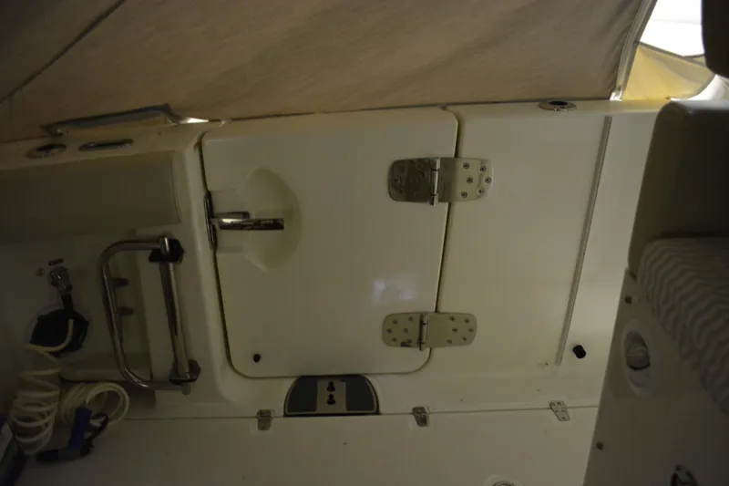 Slide: The Image of Interior of a 2019 Boston Whaler 350 Realm boat with storage and equipment. - 22