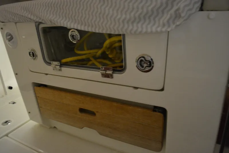 Slide: The Image of Interior view of 2019 Boston Whaler 350 Realm boat, featuring a closed hatch and safety rail. - 23