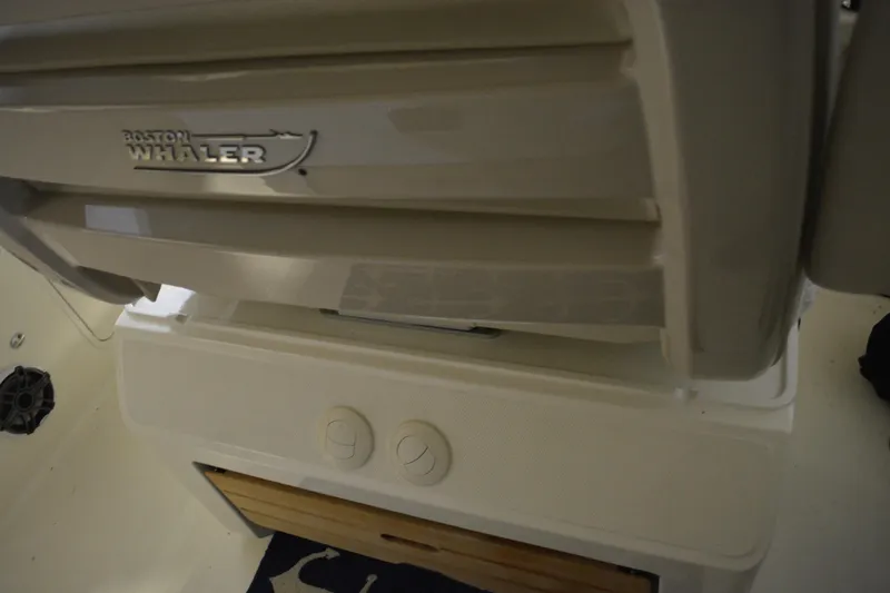 Slide: The Image of 2019 Boston Whaler 350 Realm interior seating with patterned cushion cover. - 27