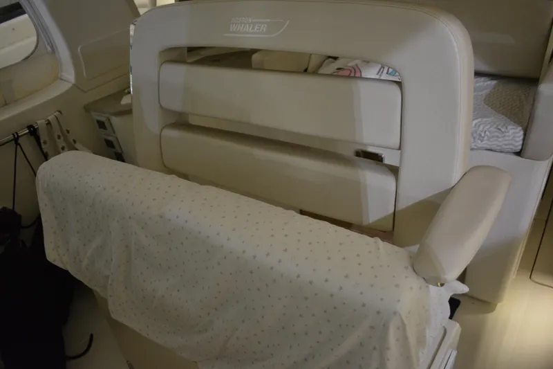 Slide: The Image of 2019 Boston Whaler 350 Realm interior view, showcasing cockpit and helm details. - 32