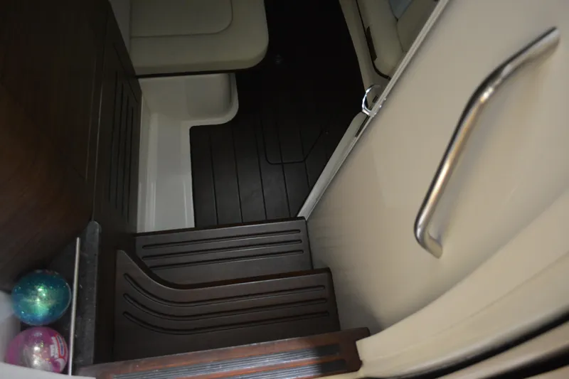 Slide: The Image of Interior cabin of 2019 Boston Whaler 350 Realm with seating and storage. - 43