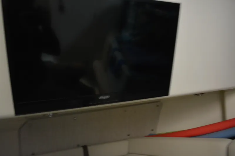 Slide: The Image of Interior view of 2019 Boston Whaler 350 Realm, featuring sleek wooden steps and modern design. - 44