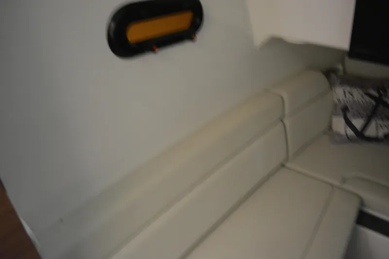 Slide: The Image of Interior seating of 2019 Boston Whaler 350 Realm with beige upholstery. - 48