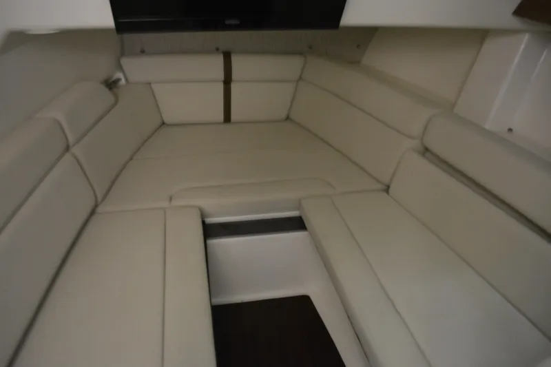 Slide: The Image of 2019 Boston Whaler 350 Realm interior cabin with beige seating. - 57
