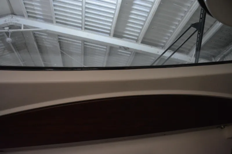 Slide: The Image of Interior view of a 2019 Boston Whaler 350 Realm boat under a metal roof. - 59