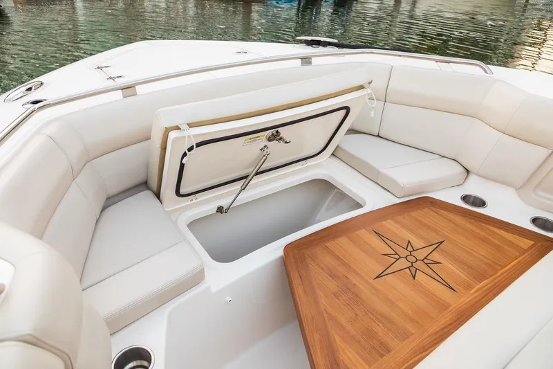 Slide: The Image of 2019 Boston Whaler 350 Realm boat hull, close-up view in a showroom. - 6