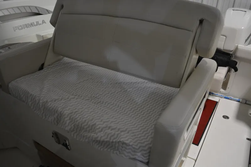 Slide: The Image of 2019 Boston Whaler 350 Realm boat seat with a patterned cover. - 79