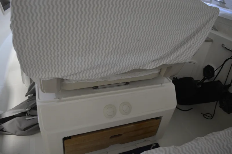 Slide: The Image of Interior of a 2019 Boston Whaler 350 Realm with covered seating area. - 80