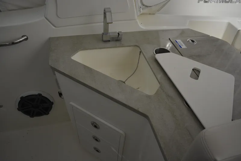 Slide: The Image of 2019 Boston Whaler 350 Realm boat interior with sink and countertop. - 81