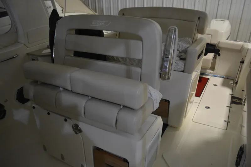 Slide: The Image of 2019 Boston Whaler 350 Realm interior seating and cockpit view. - 83
