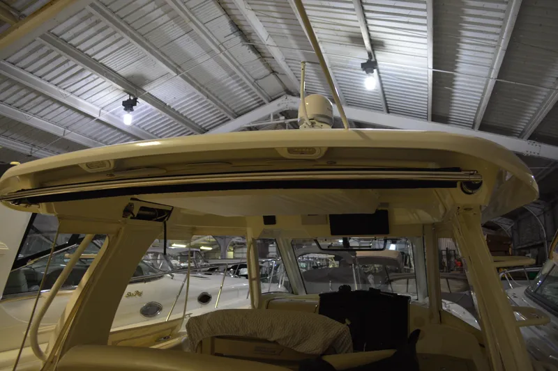 Slide: The Image of 2019 Boston Whaler 350 Realm interior view in a boat storage facility. - 89