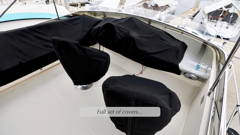 Slide: The Image of 2013 Marquis 500 Sport Bridge with full set of protective covers on deck. - 13