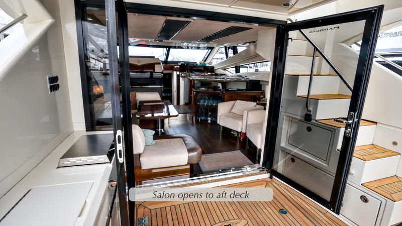 Slide: The Image of 2013 Marquis 500 Sport Bridge yacht interior with open salon and alt deck view. - 17