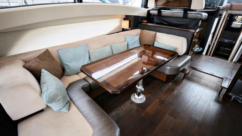 Slide: The Image of Luxurious interior of 2013 Marquis 500 Sport Bridge yacht with elegant seating and table. - 21