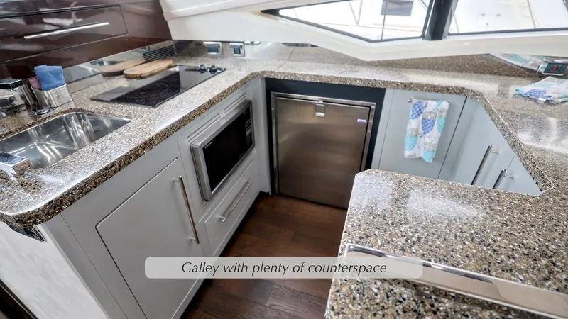 Slide: The Image of Galley kitchen in 2013 Marquis 500 Sport Bridge with ample counter space and modern appliances. - 22