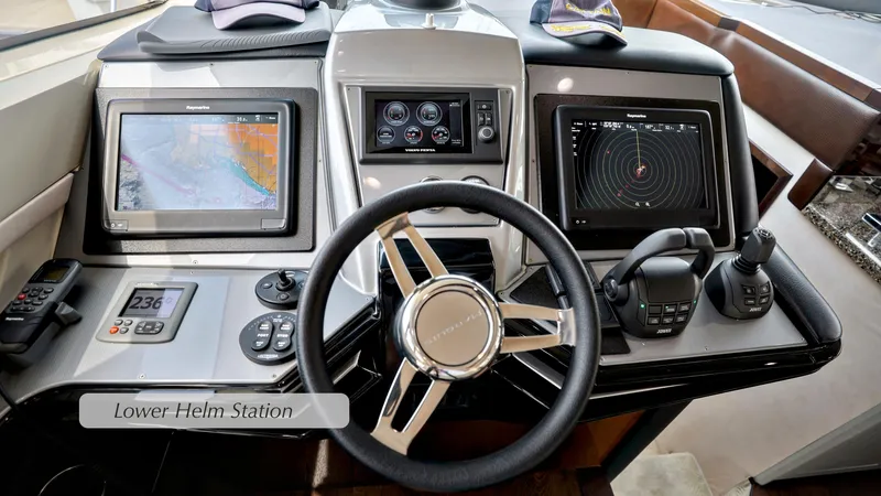 Slide: The Image of Lower helm station of 2013 Marquis 500 Sport Bridge with navigation displays and controls. - 25
