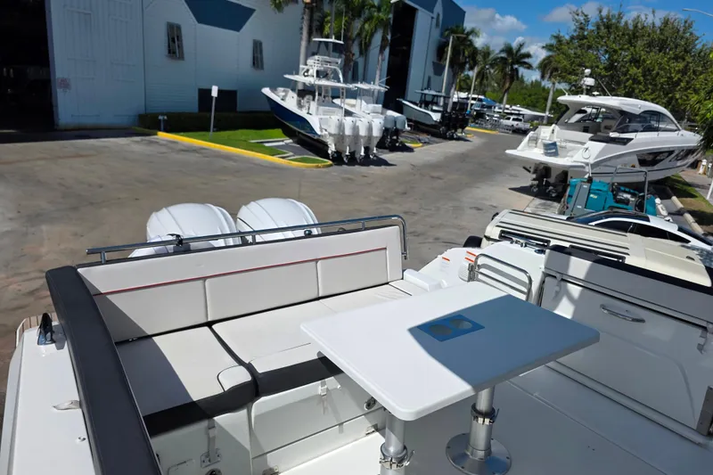 Slide: The Image of 2021 Jeanneau Leader 10.5 WA boat interior with Garmin navigation system and sleek seating. - 13