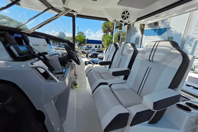 Slide: The Image of Interior of 2021 Jeanneau Leader 10.5 WA boat with modern cockpit and seating. - 26