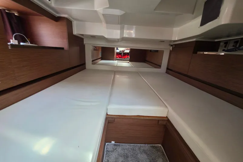 Slide: The Image of Interior of 2021 Jeanneau Leader 10.5 WA yacht, featuring a modern kitchenette with wood finish. - 39