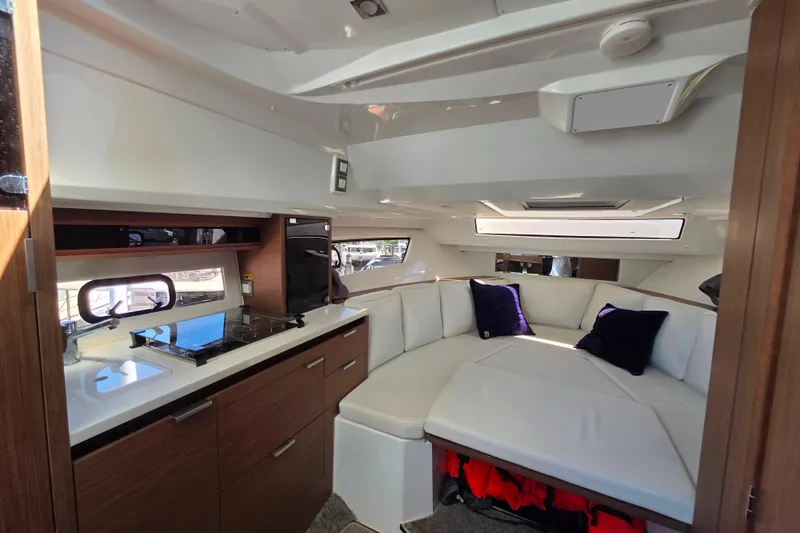 Slide: The Image of Interior of 2021 Jeanneau Leader 10.5 WA boat with cozy seating and modern amenities. - 41