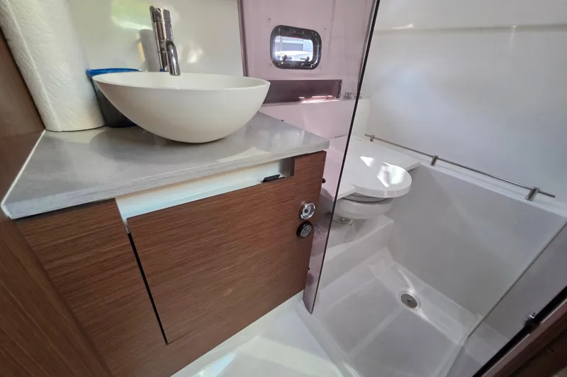 Slide: The Image of Modern bathroom in 2021 Jeanneau Leader 10.5 WA boat with sink and toilet. - 44