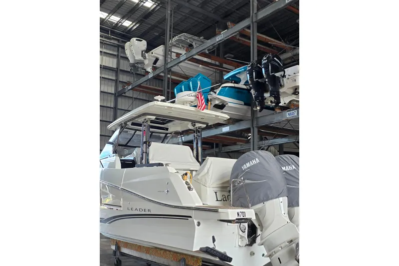 Slide: The Image of 2021 Jeanneau Leader 10.5 WA boat in storage with Yamaha engines. - 49