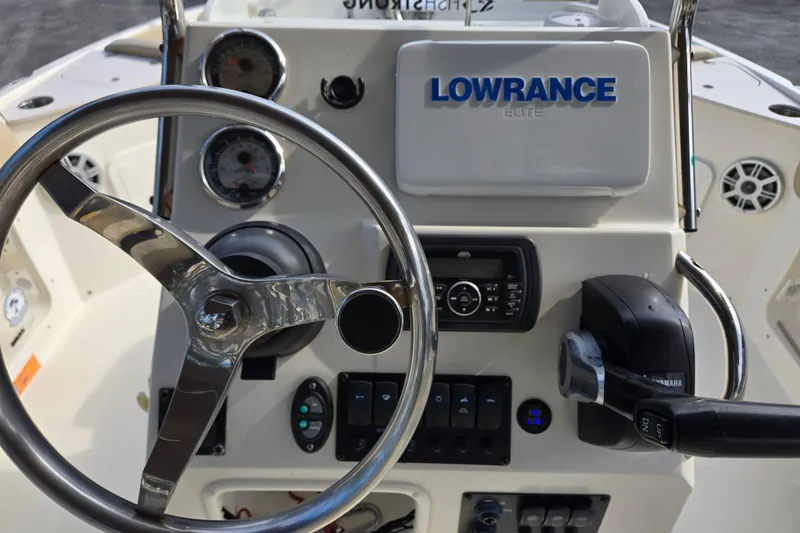 Slide: The Image of Steering console of a 2017 Stingray 206cc boat with Lowrance Elite system. - 15