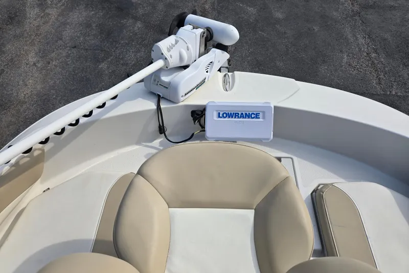 Slide: The Image of 2017 Stingray 206cc boat with Lowrance GPS and beige seating. - 17