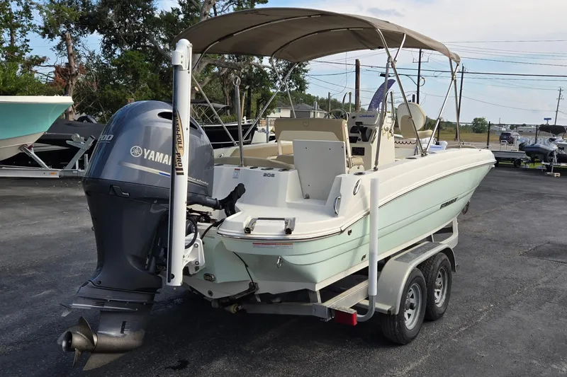 Slide: The Image of 2017 Stingray 206cc boat with Yamaha outboard motor on a trailer. - 3