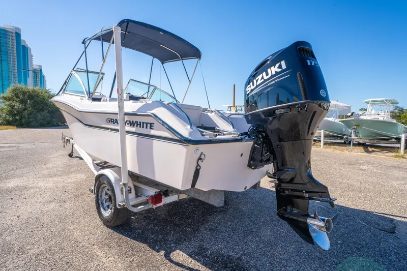 Slide: The Image of 1999 Grady-White Tournament 192 boat with Suzuki outboard motor on trailer. - 3