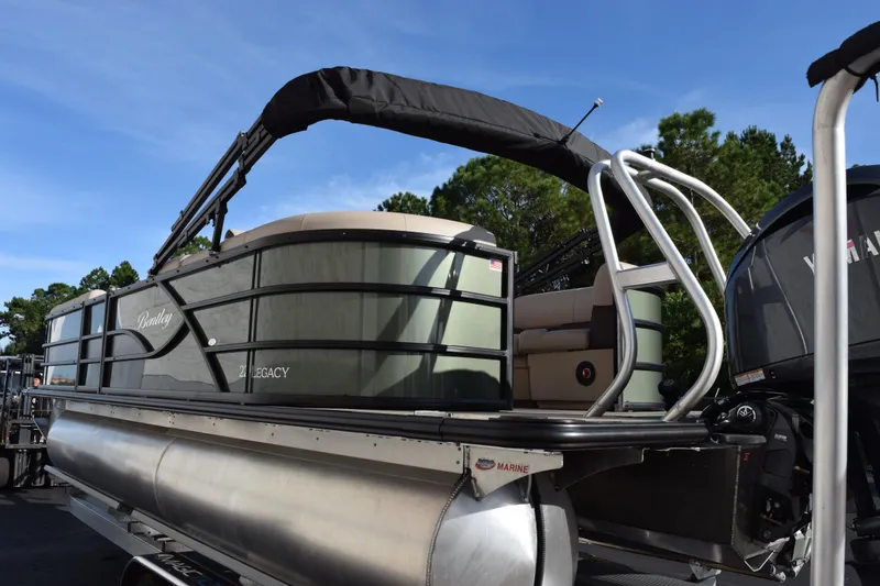 Slide: The Image of 2026 Bentley Pontoons Legacy 223 Navigator, sleek design, outdoor setting, blue sky background. - 14