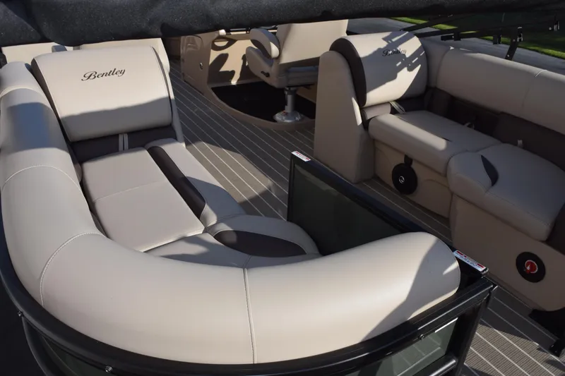 Slide: The Image of 2026 Bentley Pontoons Legacy 223 Navigator interior with luxurious beige seating. - 15
