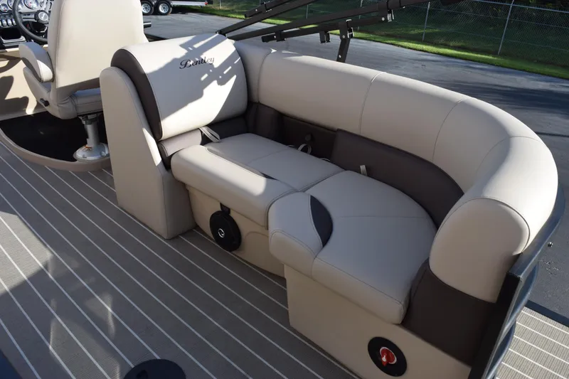 Slide: The Image of 2026 Bentley Pontoons Legacy 223 Navigator interior seating, beige and brown upholstery. - 16