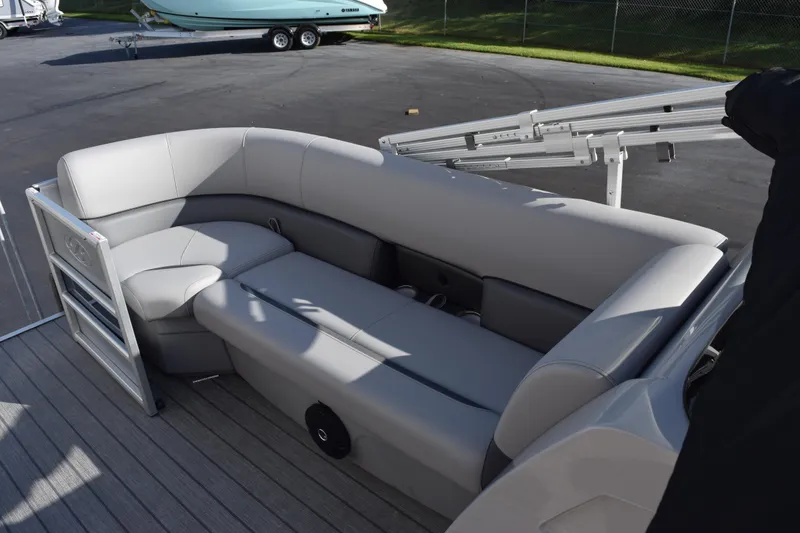 Slide: The Image of 2026 Bentley Pontoons Legacy 243 Navigator with sleek gray seating on deck. - 12