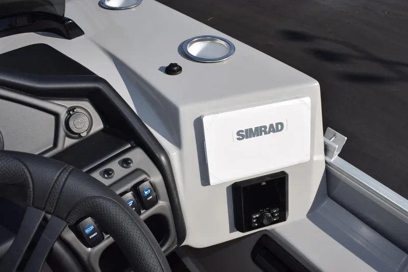 Slide: The Image of 2026 Bentley Pontoons Legacy 243 Navigator dashboard with Simrad display and controls. - 15