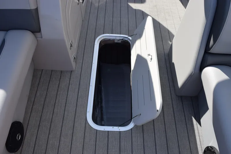 Slide: The Image of 2026 Bentley Pontoons Legacy 243 Navigator interior storage compartment open on deck. - 20