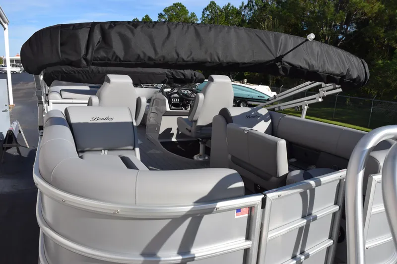 Slide: The Image of 2026 Bentley Pontoons Legacy 243 Navigator with sleek seating and canopy. - 7