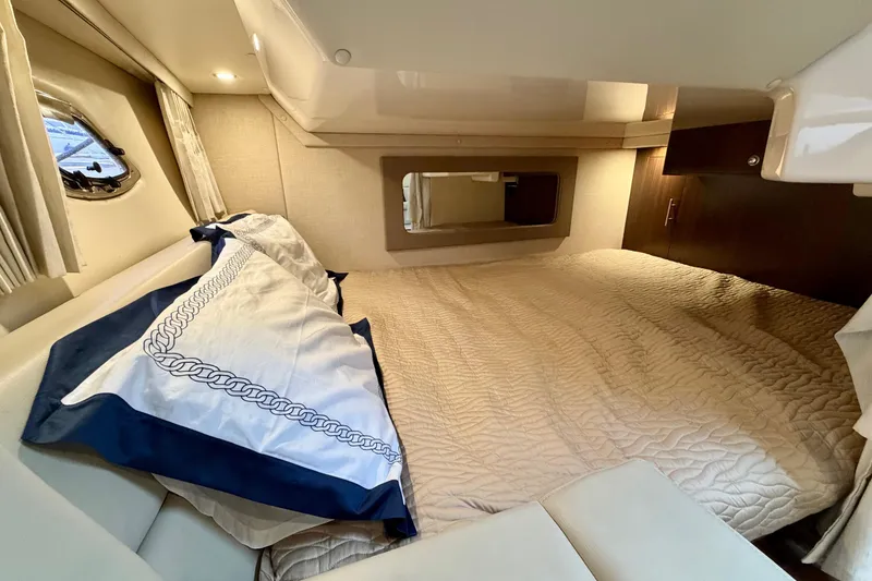 Slide: The Image of Luxurious cabin interior of 2017 Regal 35 Sport Coupe with cozy bedding. - 10