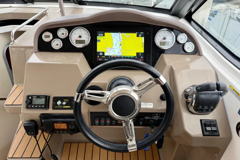 Slide: The Image of Cockpit of 2017 Regal 35 Sport Coupe with steering wheel and navigation display. - 15