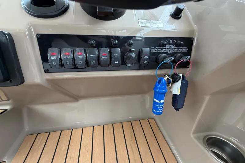 Slide: The Image of Control panel of a 2017 Regal 35 Sport Coupe with switches and keys. - 17