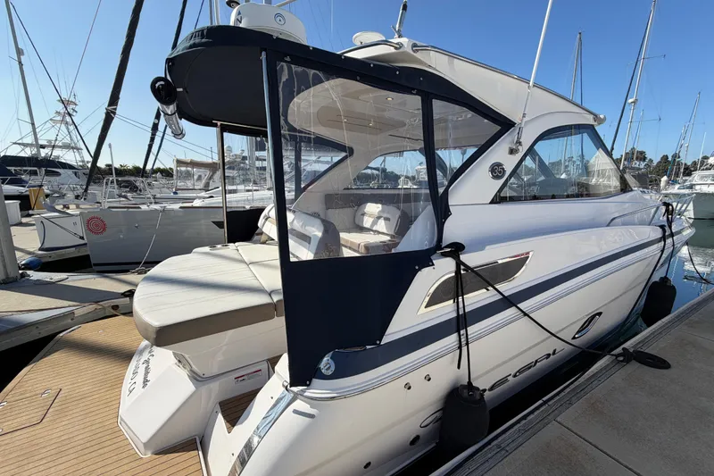 Slide: The Image of 2017 Regal 35 Sport Coupe yacht docked at marina, showcasing sleek design and luxury features. - 41