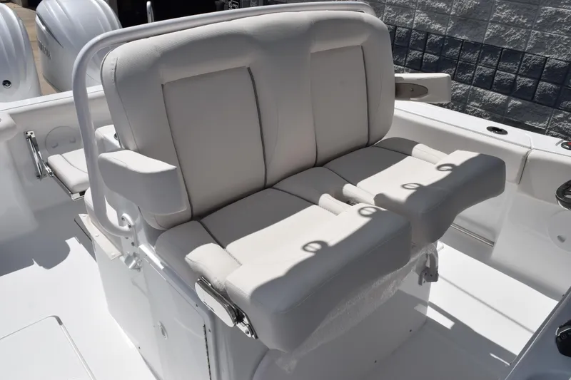 Slide: The Image of Luxury seating on 2026 Sea Hunt Gamefish 27 Coffin Box boat, featuring plush white cushions. - 10
