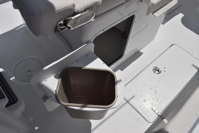 Slide: The Image of 2026 Sea Hunt Gamefish 27 Coffin Box interior with storage compartment and seat detail. - 16