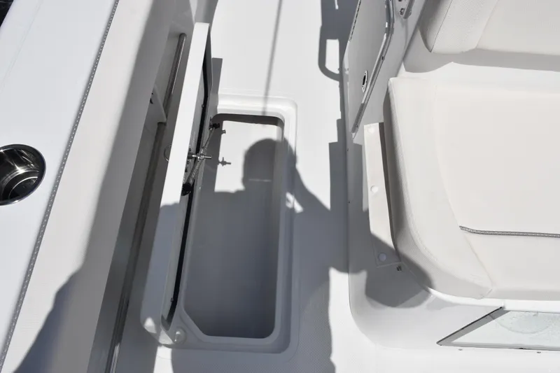 Slide: The Image of 2026 Sea Hunt Gamefish 27 Coffin Box interior with open storage compartment. - 17