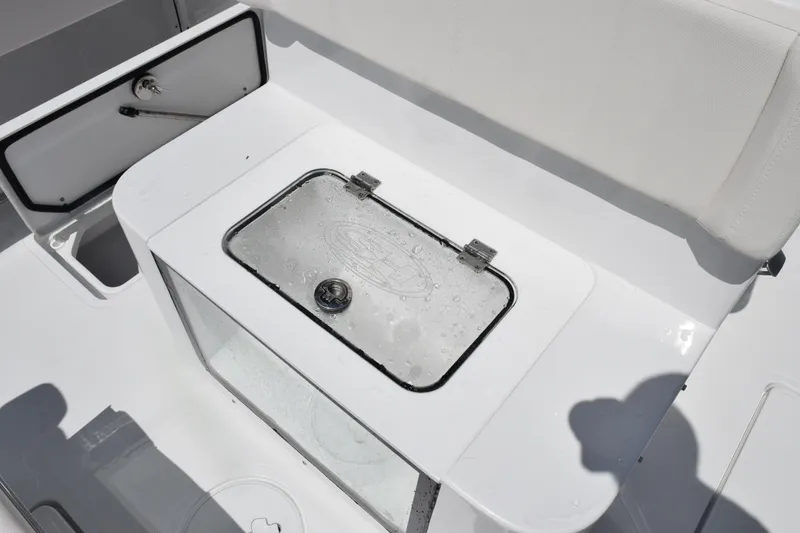 Slide: The Image of 2026 Sea Hunt Gamefish 27 Coffin Box interior with storage compartment. - 19