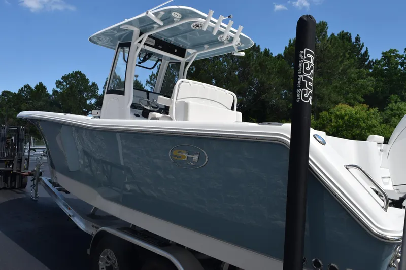 Slide: The Image of 2026 Sea Hunt Gamefish 27 Coffin Box boat, sleek design, parked outdoors. - 5