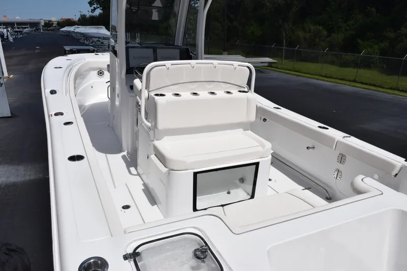 Slide: The Image of 2026 Sea Hunt Gamefish 27 Coffin Box boat interior with seating and storage. - 6