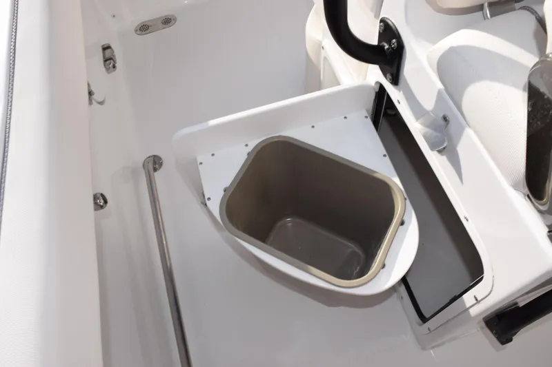 Slide: The Image of 2026 Sea Hunt Ultra 255 SE boat interior with built-in storage compartment. - 16