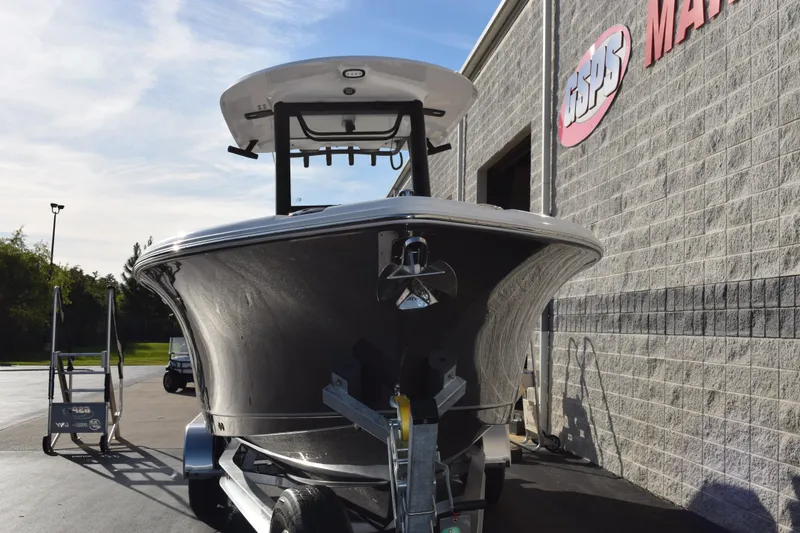 Slide: The Image of 2026 Sea Hunt Ultra 255 SE boat on trailer outside a marine dealership. - 3